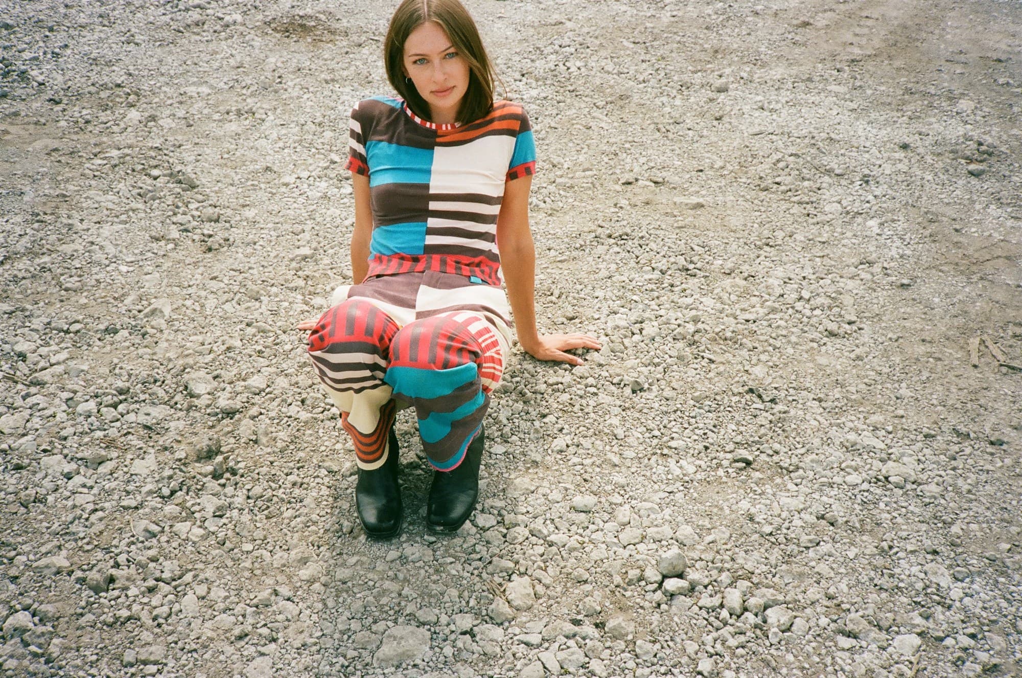 A model wearing a striped Issey Miyake set